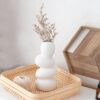Unique artisan ceramic vase with smooth pebble texture – modern white décor