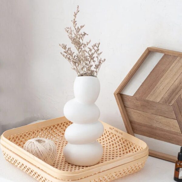 Unique artisan ceramic vase with smooth pebble texture – modern white décor