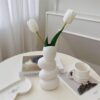 Matte white ceramic vase with organic pebble shape – artisan décor accent
