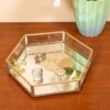 Elegant hexagonal glass tray with brass rim and mirrored base for luxury decor