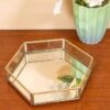 Gold vanity tray with mirror bottom and sleek hexagon glass design