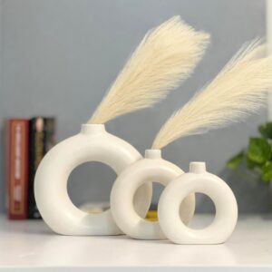 White ceramic donut flower vase with hollow circular design for modern home decor