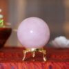 Rose quartz crystal orb for home décor and spiritual healing