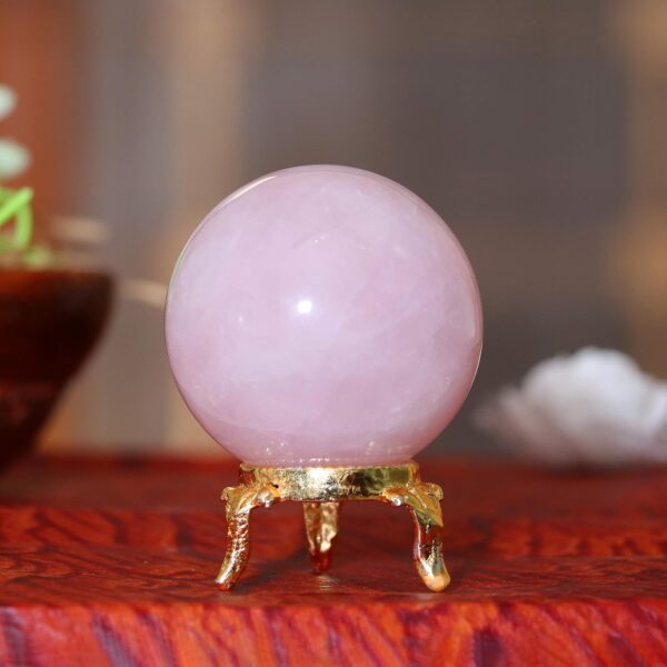 Rose quartz crystal orb for home décor and spiritual healing