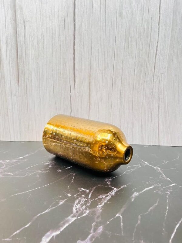Handcrafted shiny gold metal vase with hammered texture for flowers