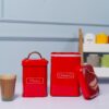 Stylish red tea and sugar jars with airtight lids