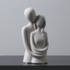 Romantic couple figurine hugging statue in resin finish