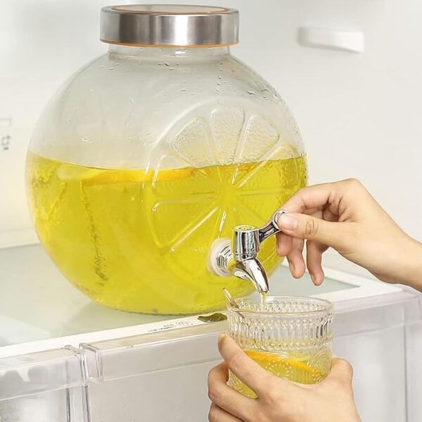 Crystal-clear glass tower drink dispenser with tap