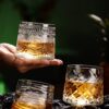 Stylish Whiskey Glass with Rotating Bottom for Smooth Bar