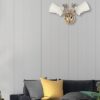 Wall lamp with clear decorative glass shade and metal fixture