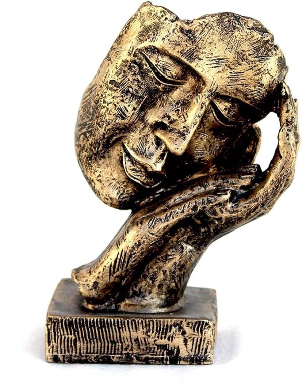 Artistic resin sculpture of human face design with resting hand, decorative centerpiece