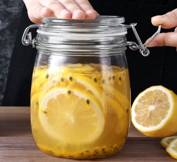 Durable glass storage jar with metal clasp and rubber seal