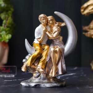 Romantic couple statue sitting on crescent moon showpiece