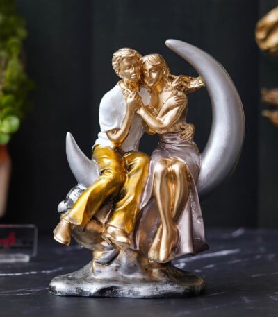 Romantic couple statue sitting on crescent moon showpiece