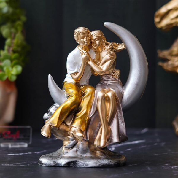 Romantic couple statue sitting on crescent moon showpiece