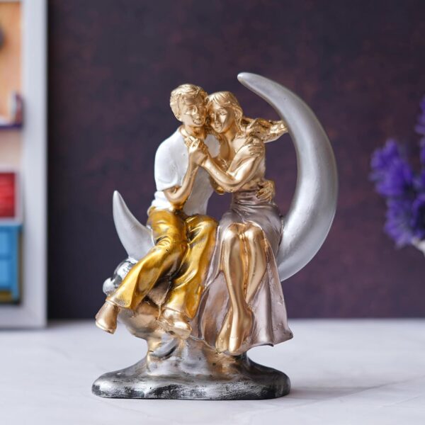 Resin romantic couple figurine sitting on moon with elegant finish
