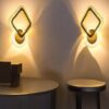 Sleek LED wall light in gold finish for luxury home lighting