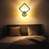 Modern LED wall light in golden finish with minimalist style