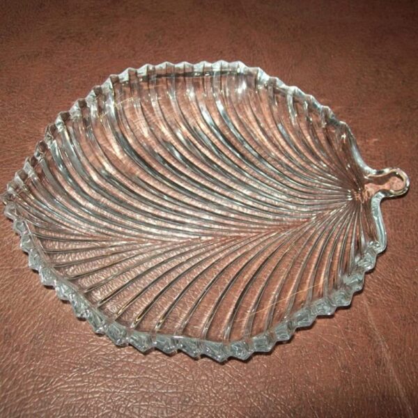 Elegant crystal glass plate shaped like a leaf