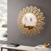 Round wall mirror with golden iron leaves and stems
