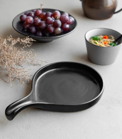 Stylish ceramic serving platter with handle for dinner parties