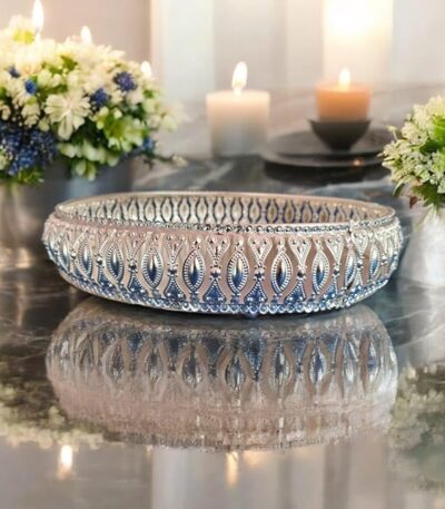Decorative silver basket tray used as pooja plate for temple rituals