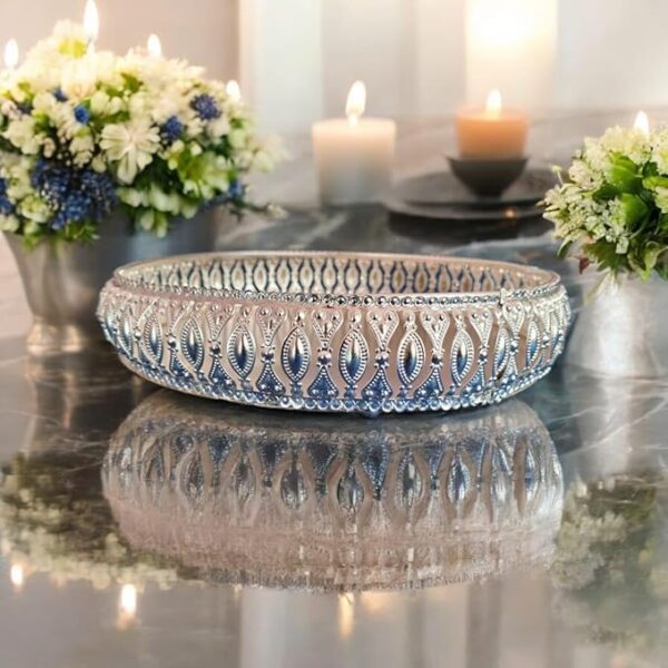 Decorative silver basket tray used as pooja plate for temple rituals