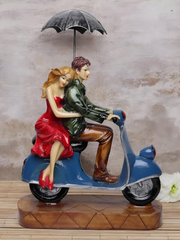 Beautiful romantic couple on scooter resin art for shelf display