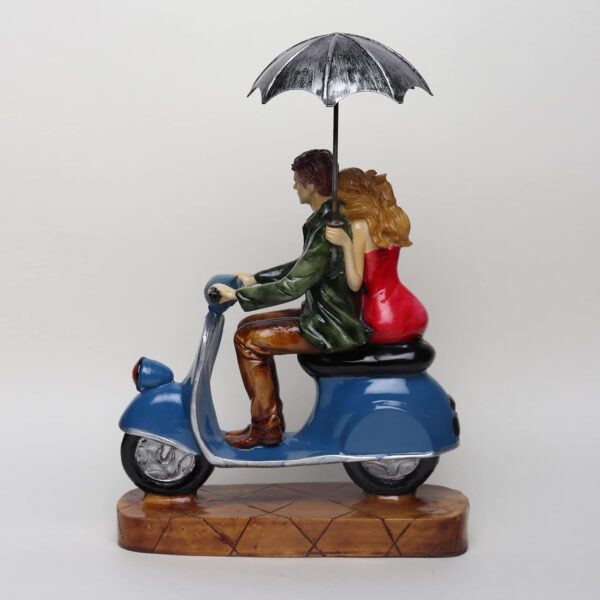 Artistic scooter couple figurine symbolizing romance and travel