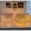 Elegant tulip-shaped cube mirror lamp glowing at night