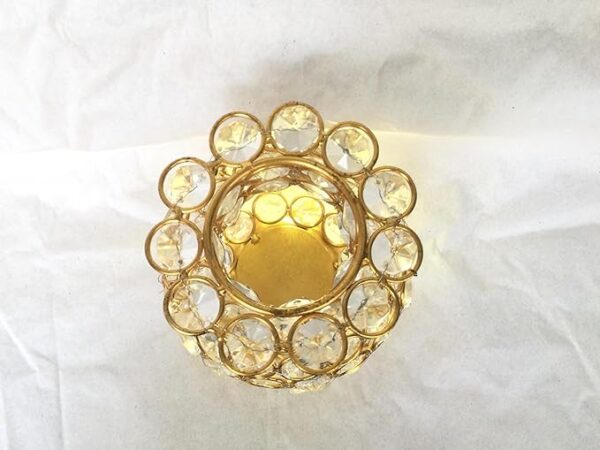 Decorative metal flower vase with golden polish and crystals