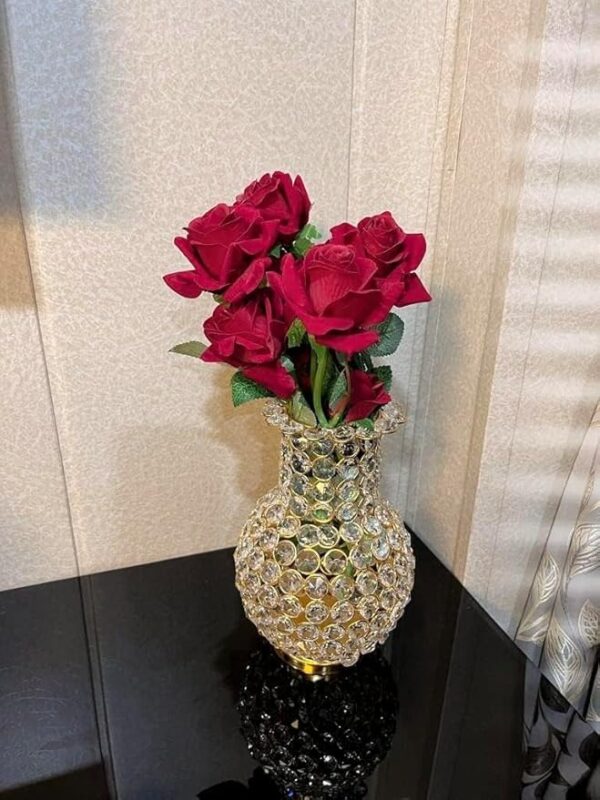 Shiny golden vase with embedded crystal