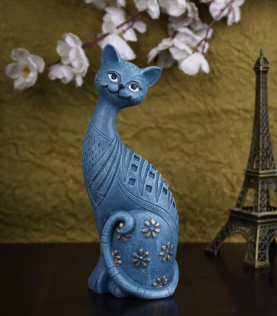 Cute and modern handicraft resin art cat figurine placed on a wooden table