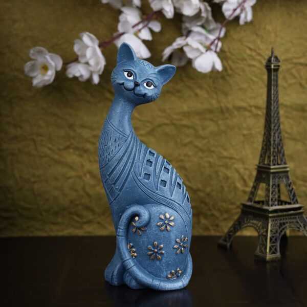 Cute and modern handicraft resin art cat figurine placed on a wooden table