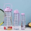 Transparent 2L water bottle set with motivational quotes, straw, and handle