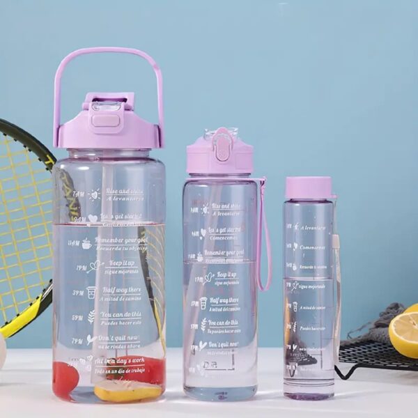 Transparent 2L water bottle set with motivational quotes, straw, and handle