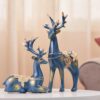 Creative golden reindeer sculpture made of resin for home decor
