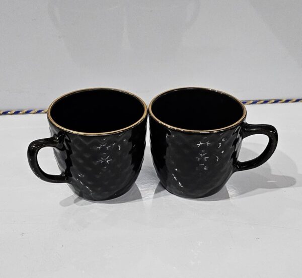 Decorative ceramic tea cup on embossed Black tray