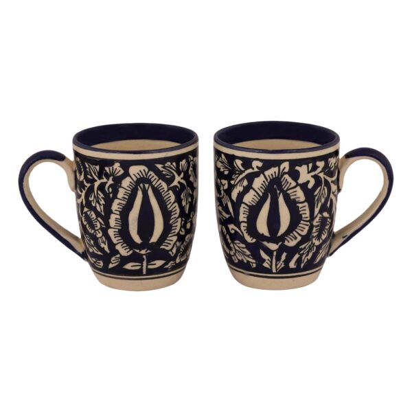 Matte finish ceramic cup placed beside coffee beans