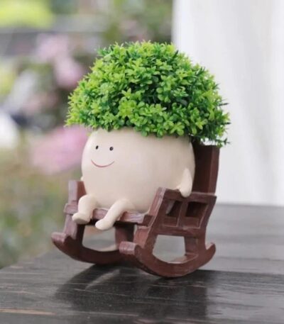 Cute Smiley Face Resin Planter Pot with green succulent plant