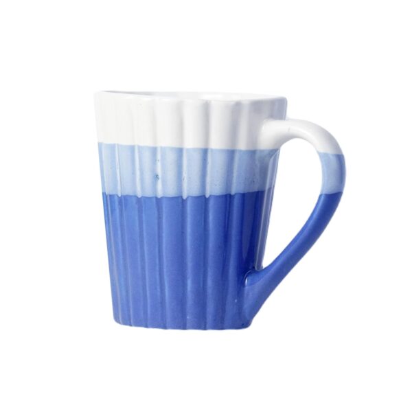 Elegant handcrafted blue ceramic mug with grooved design