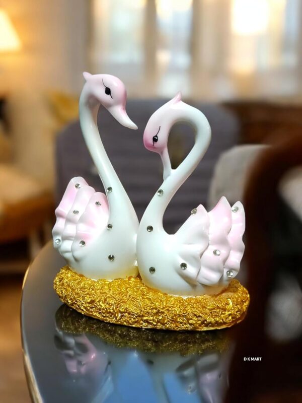 Glossy pink and white marble swan figurines