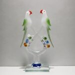 Colorful resin parrot sculpture on branch – decorative bird showpiece