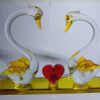 Romantic glass swan couple figurine with heart-shaped design