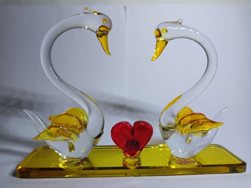 Romantic glass swan couple figurine with heart-shaped design