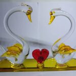Romantic glass swan couple figurine with heart-shaped design