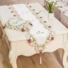 Decorative satin table runner with embroidered flowers and lace trim
