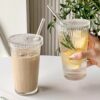 Transparent glass tumbler with lid and reusable straw for drinks