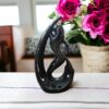 Artistic black finish mermaid figurine holding fish sculpture