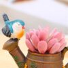 Handcrafted watering can container with bird design flower planter